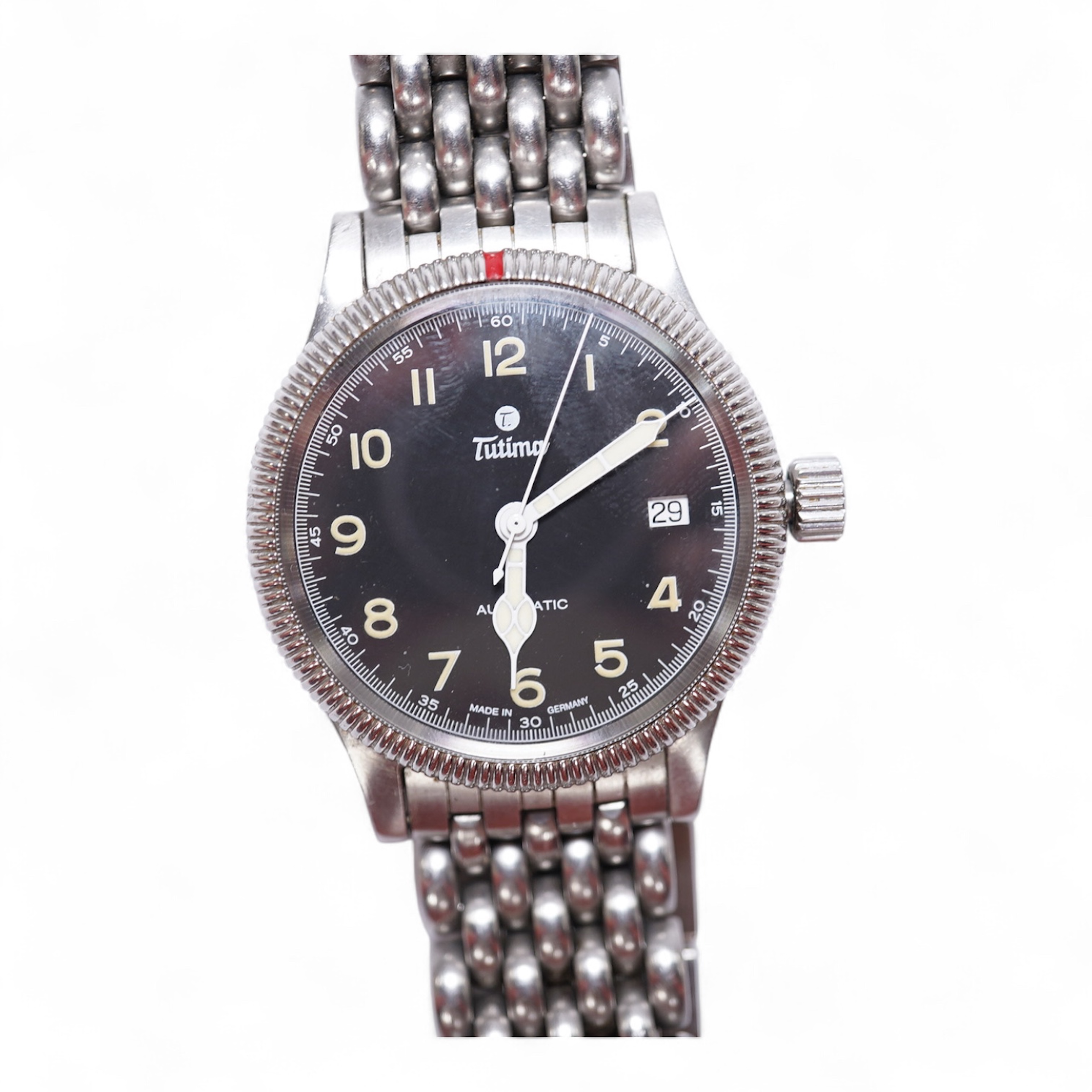 A gentleman's German stainless steel Tutima Flieger Automatic wrist watch, with black Arabic luminous dial and date aperture, cased diameter 36mm, on a stainless steel Tutima bracelet, with box and pamphlet. Condition -